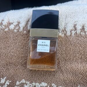 CHANEL No.5 Eau de Parfum — Amber Liquid with Gold & Black Accents
